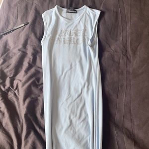 Light blue body con dress with Angel Energy written in rhinestones size small
